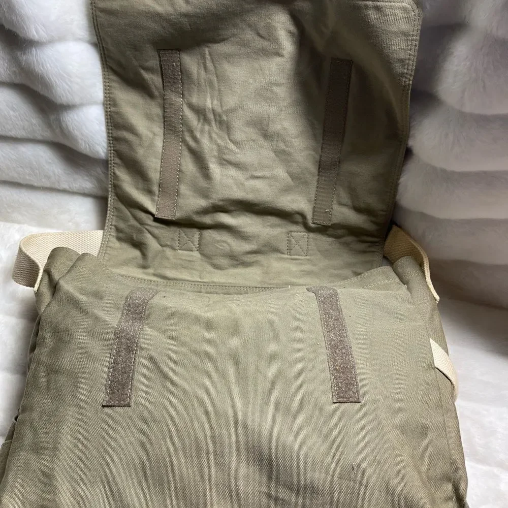Lucky Brand large canvas olive green messenger bag with adjustable beige strap.